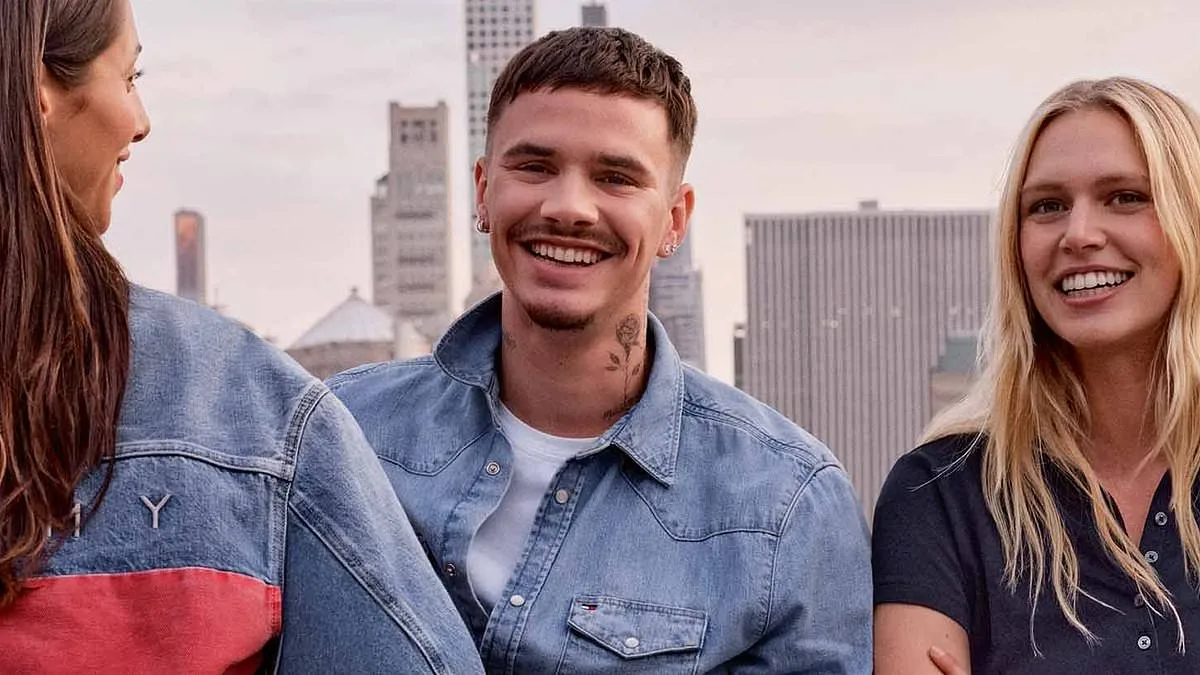 Romeo Beckham steals his father David's style in double denim as he models for new Tommy Hilfiger campaign